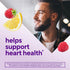Smiling man with a raspberry, lemon slice, and raspberry; graphic text reads 'helps support heart health'.
