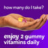 Hand holding one yellow and one purple VF Omega-3 Gummy vitamin, with text 'how many do I take?' and 'enjoy 2 gummy vitamins daily'.
