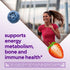 Young woman running outdoors, smiling, with a blueberry and strawberry for Women's Multi Gummy, supporting energy, bone, immune health.
