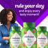 A young woman smiles next to a vitafusion B12 gummy bottle, accompanied by vitafusion Multivites and Power C bottles.