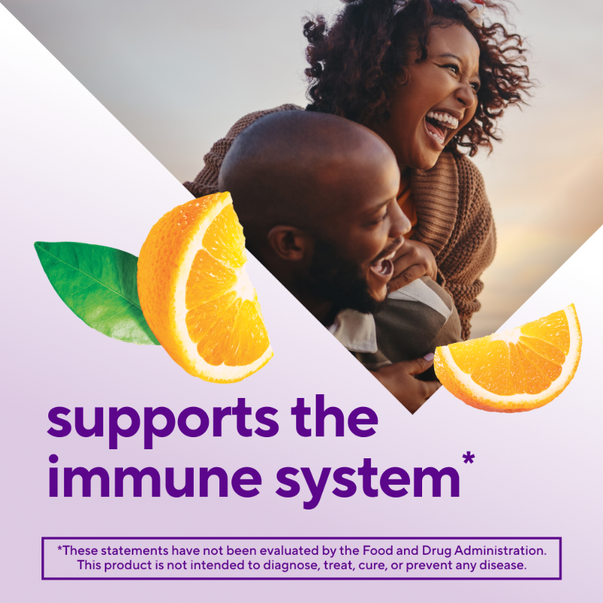 Happy couple embracing; graphic includes orange slices and text 'supports the immune system'.