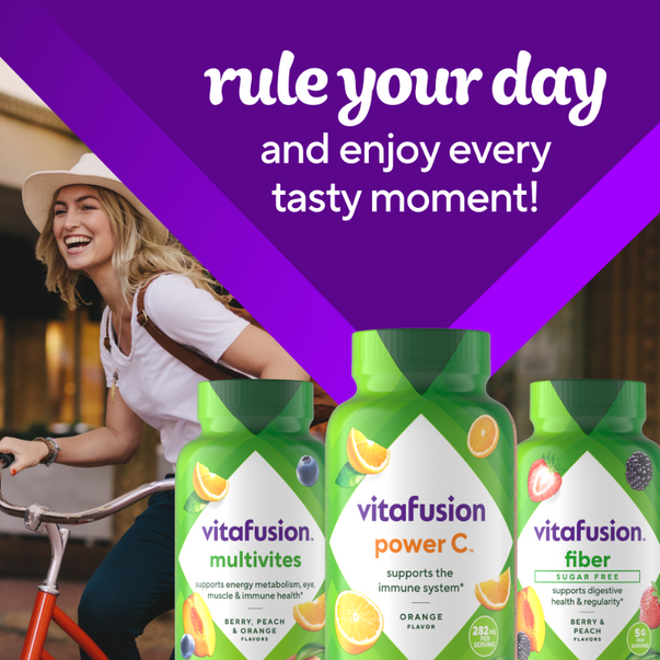 Vitafusion Power C 282mg orange gummies with Multivites and Fiber bottles. Text: 'rule your day and enjoy every tasty moment!'