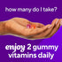 A hand holds two VF Probiotic 5 Billion CFU gummy vitamins. Text advises: 'Enjoy 2 gummy vitamins daily.'